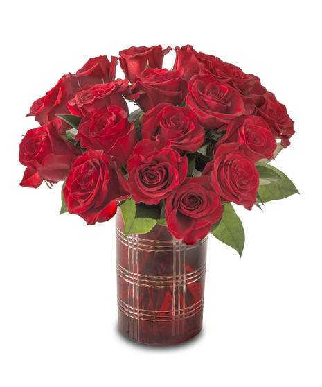 A compact arrangement of red roses accented with white baby’s breath and greenery, designed in a small vase and standing approximately 12–14 inches tall.