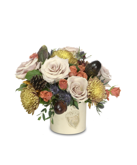 Elegant floral arrangement in watercolor acorn pot: beige and orange roses, rust accents, and acorn embellishments. A timeless testament to autumn's allure.