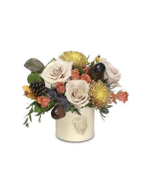 Elegant floral arrangement in watercolor acorn pot: beige and orange roses, rust accents, and acorn embellishments. A timeless testament to autumn's allure.
