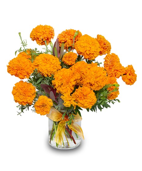 Vase arrangement of orange marigolds with textured greenery including red leucadendron and eucalyptus, honoring Day of the Dead, handcrafted by Walter Knoll Florist.