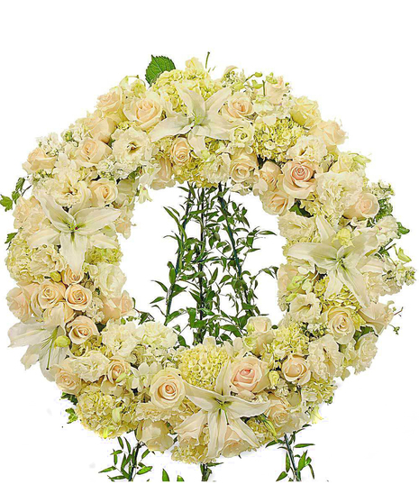 about elegant white wreath on ruscus wrapped easel from Walter