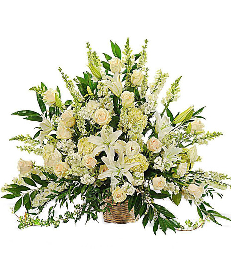 about elegant white wreath on ruscus wrapped easel from Walter Knoll  Florist, St Louis, MO