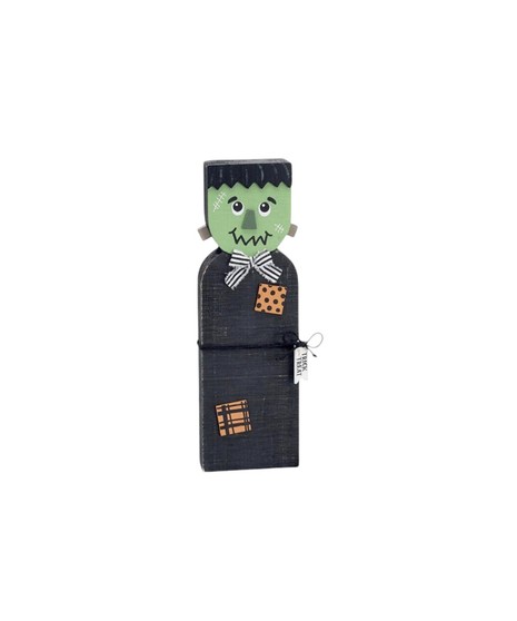 Wooden Halloween decorations including a green Frankenstein, a gray witch with a hat, and a black cat with an orange bow