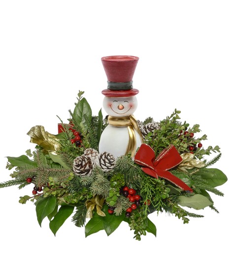 Snowman centerpiece with red roses, carnations, pinecones, berries, and winter greens in a festive holiday arrangement featuring a 7-inch Frosty figurine.