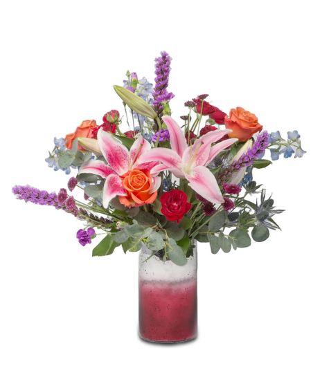 A vibrant summer bouquet with Stargazer Lilies, Orange Crush Roses, blue Delphinium, purple Liatris, red miniature roses, and purple button mums.