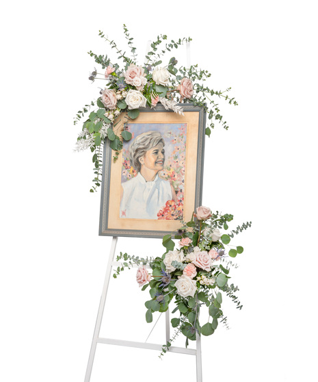 about elegant white wreath on ruscus wrapped easel from Walter Knoll  Florist, St Louis, MO