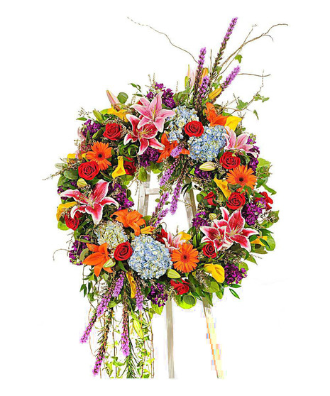 about elegant white wreath on ruscus wrapped easel from Walter Knoll  Florist, St Louis, MO