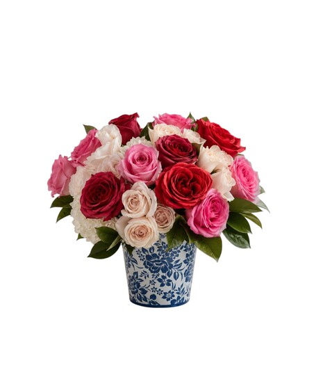 Victorian Tea floral arrangement featuring pink roses, miniature roses, and white hydrangeas in a blue and white ceramic container