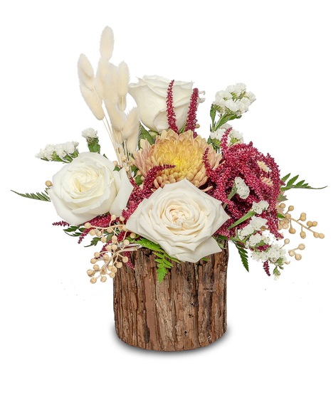 Elegant arrangement in rustic wooden cylinder: ivory roses, peach mums, bleach bunny wheat, and deep burgundy hues. An embodiment of serene autumn beauty.