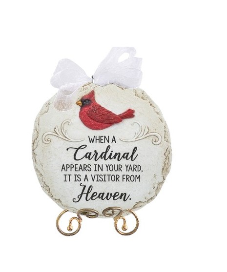 Round stepping stone with a red cardinal and the words: “When a cardinal appears in your yard, it is a visitor from Heaven.”