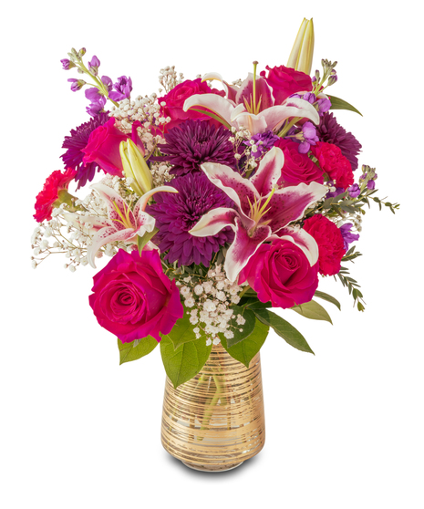 Colorful floral arrangement with pink roses, stargazer lilies, purple mums, and baby’s breath in a gold glass vase, styled in a lush, rounded design.