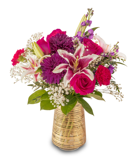 Colorful floral arrangement with pink roses, stargazer lilies, purple mums, and baby’s breath in a gold glass vase, styled in a lush, rounded design.